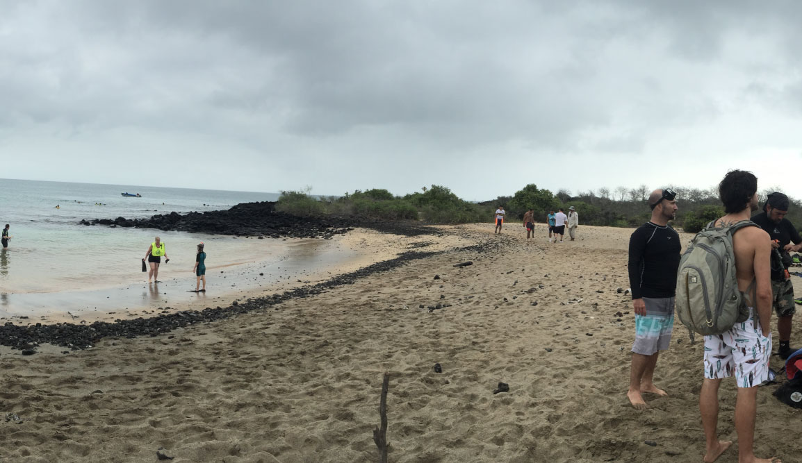 Post Office - Floreana Island in the Galapagos, view of a beach with tourists