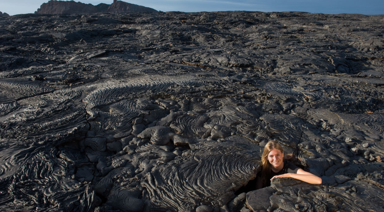 Sullivan bay, solid volcanic lava with tourist girl